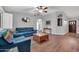 Cozy living room with hardwood floors, blue couches, and neutral paint at 37508 N 12Th St, Phoenix, AZ 85086