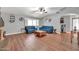 Bright living room with hardwood floors, two blue couches, and neutral walls at 37508 N 12Th St, Phoenix, AZ 85086
