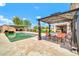 A backyard oasis with a pool, outdoor seating area, and a cabana, creating a perfect space for relaxation and entertainment at 37508 N 12Th St, Phoenix, AZ 85086