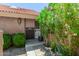 Charming entryway with lush greenery and a secure screen door at 4033 E Larkspur Dr, Phoenix, AZ 85032