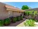 Inviting home exterior with lush, mature landscaping and a charming tile roof at 4033 E Larkspur Dr, Phoenix, AZ 85032