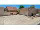 Home exterior features a two-car garage, large driveway, and low-maintenance landscaping at 4033 E Larkspur Dr, Phoenix, AZ 85032