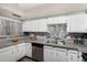 Well-lit kitchen featuring stainless steel appliances, granite countertops, and stylish backsplash at 4033 E Larkspur Dr, Phoenix, AZ 85032