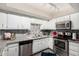 Well-lit kitchen featuring stainless steel appliances, granite countertops, and stylish backsplash at 4033 E Larkspur Dr, Phoenix, AZ 85032
