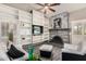 Cozy living room with fireplace and built-in shelving for storage and decor at 4033 E Larkspur Dr, Phoenix, AZ 85032