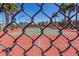 A community tennis court is surrounded by lush greenery, offering a scenic spot for recreational activities at 4033 E Larkspur Dr, Phoenix, AZ 85032