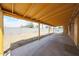 Large covered backyard patio with concrete flooring, perfect for outdoor entertaining and relaxation at 4102 W Maryland Ave, Phoenix, AZ 85019