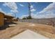 Wide angle view of a backyard and its large potential, bordered by CMU and wood fencing at 4102 W Maryland Ave, Phoenix, AZ 85019