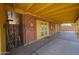 Covered back patio showing access to the main structure with double doors and a single back door at 4102 W Maryland Ave, Phoenix, AZ 85019