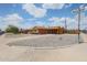 Street corner view of a well-kept single-story home with low maintenance rock yard at 4102 W Maryland Ave, Phoenix, AZ 85019