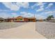 Charming brick and yellow single-story home with a well-maintained, low-maintenance front yard at 4102 W Maryland Ave, Phoenix, AZ 85019