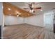 Open concept living area with tile flooring, updated lighting, and stylish wood plank ceiling at 4102 W Maryland Ave, Phoenix, AZ 85019