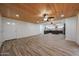 Bright, open-concept living space featuring tile floors and a unique wood plank ceiling at 4102 W Maryland Ave, Phoenix, AZ 85019