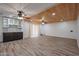 Spacious living area featuring tile flooring, ceiling fans, and a stylish wood plank ceiling at 4102 W Maryland Ave, Phoenix, AZ 85019