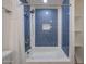Shower with modern fixtures, tiled walls and updated shower head at 4102 W Maryland Ave, Phoenix, AZ 85019