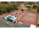 Aerial view of backyard featuring pool, gazebo, and tennis court at 4107 E Fairview Cir, Mesa, AZ 85206