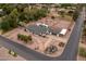 Aerial view of the property featuring a pool, tennis court, mature landscaping, and ample parking at 4107 E Fairview Cir, Mesa, AZ 85206