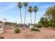 Backyard with pool, tennis court and detached structures at 4107 E Fairview Cir, Mesa, AZ 85206