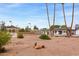 The backyard area features a tennis court and gazebo that offer a recreational space at 4107 E Fairview Cir, Mesa, AZ 85206