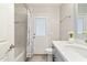 This bathroom offers a single sink vanity with a door to the exterior and a shower/tub combo at 4107 E Fairview Cir, Mesa, AZ 85206