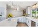 Beautiful kitchen with stainless steel appliances, modern cabinetry, quartz countertop and wooden floors at 4107 E Fairview Cir, Mesa, AZ 85206