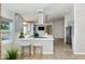 Bright kitchen with stainless appliances, modern cabinetry, breakfast bar and wood flooring at 4107 E Fairview Cir, Mesa, AZ 85206