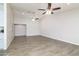 Large open living area featuring wood-look tile flooring, recessed lighting and tall ceilings at 4107 E Fairview Cir, Mesa, AZ 85206