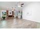 Open-concept living space with a fireplace, views into the kitchen, and abundant natural light at 4107 E Fairview Cir, Mesa, AZ 85206