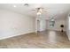Spacious living room with wood-look tile floors, ceiling fans and recessed lighting throughout at 4107 E Fairview Cir, Mesa, AZ 85206