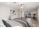 Spacious main bedroom features an en-suite gym, ceiling fan, and neutral color palette at 4107 E Fairview Cir, Mesa, AZ 85206