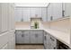 Walk in pantry with modern gray cabinets, quartz countertop and under cabinet lighting at 4107 E Fairview Cir, Mesa, AZ 85206