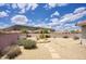 Desert backyard with a brick fence, rock features, a view of the mountain, and a beautiful blue sky at 4141 W Potter Dr, Glendale, AZ 85308