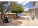 Desert backyard featuring blue accent wall, barbecue, patio area, and desert landscaping at 4141 W Potter Dr, Glendale, AZ 85308