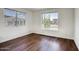 A sunlit bedroom with beautiful flooring and bright windows showcasing neighborhood views at 4141 W Potter Dr, Glendale, AZ 85308