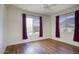 The spacious bedroom boasts beautiful floors and two large windows for natural light and views at 4141 W Potter Dr, Glendale, AZ 85308
