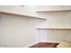 A walk-in closet with built-in shelves and hardwood floors, offering ample storage space at 4141 W Potter Dr, Glendale, AZ 85308