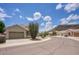 A low-angle view shows a home on a quiet street with a neatly maintained desert landscape at 4141 W Potter Dr, Glendale, AZ 85308