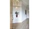 The foyer features wood-look tile flooring and niche with decorative plant in a well-lit entry at 4141 W Potter Dr, Glendale, AZ 85308