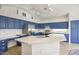 Open kitchen with blue cabinetry, stainless steel appliances, and a spacious island at 4141 W Potter Dr, Glendale, AZ 85308