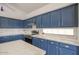 Kitchen featuring blue cabinets, stainless steel appliances, and marble countertops at 4141 W Potter Dr, Glendale, AZ 85308