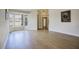 Bright living room with wood-look flooring and a large bay window with natural light at 4141 W Potter Dr, Glendale, AZ 85308