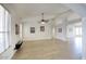Bright living room with tile floors, ceiling fan, and arched entryway to adjoining rooms at 4141 W Potter Dr, Glendale, AZ 85308