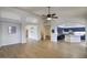 An open layout showcases wood-look floors and provides views into the kitchen and other living spaces at 4141 W Potter Dr, Glendale, AZ 85308