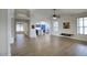 An open living space features wood-look floors and a view of the kitchen and dining area at 4141 W Potter Dr, Glendale, AZ 85308