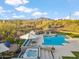 Stunning backyard with pool, spa, lounge, and beautiful mountain views, creating the perfect outdoor oasis at 4448 E Sleepy Ranch Rd, Cave Creek, AZ 85331