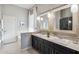 Elegant bathroom with double sinks, stylish mirrors, and a separate soaking tub at 4448 E Sleepy Ranch Rd, Cave Creek, AZ 85331