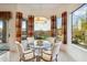Bright dining area with a modern chandelier and views of the pool and backyard at 4448 E Sleepy Ranch Rd, Cave Creek, AZ 85331