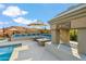 Backyard pool with custom stone fireplace, lounge seating and desert landscaping at 4448 E Sleepy Ranch Rd, Cave Creek, AZ 85331