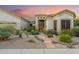 Beautiful front yard with desert landscaping, a stone walkway, and warm lighting at 4448 E Sleepy Ranch Rd, Cave Creek, AZ 85331