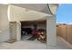 Open garage with cars, a drill press, and accessories on a gray painted floor at 4448 E Sleepy Ranch Rd, Cave Creek, AZ 85331